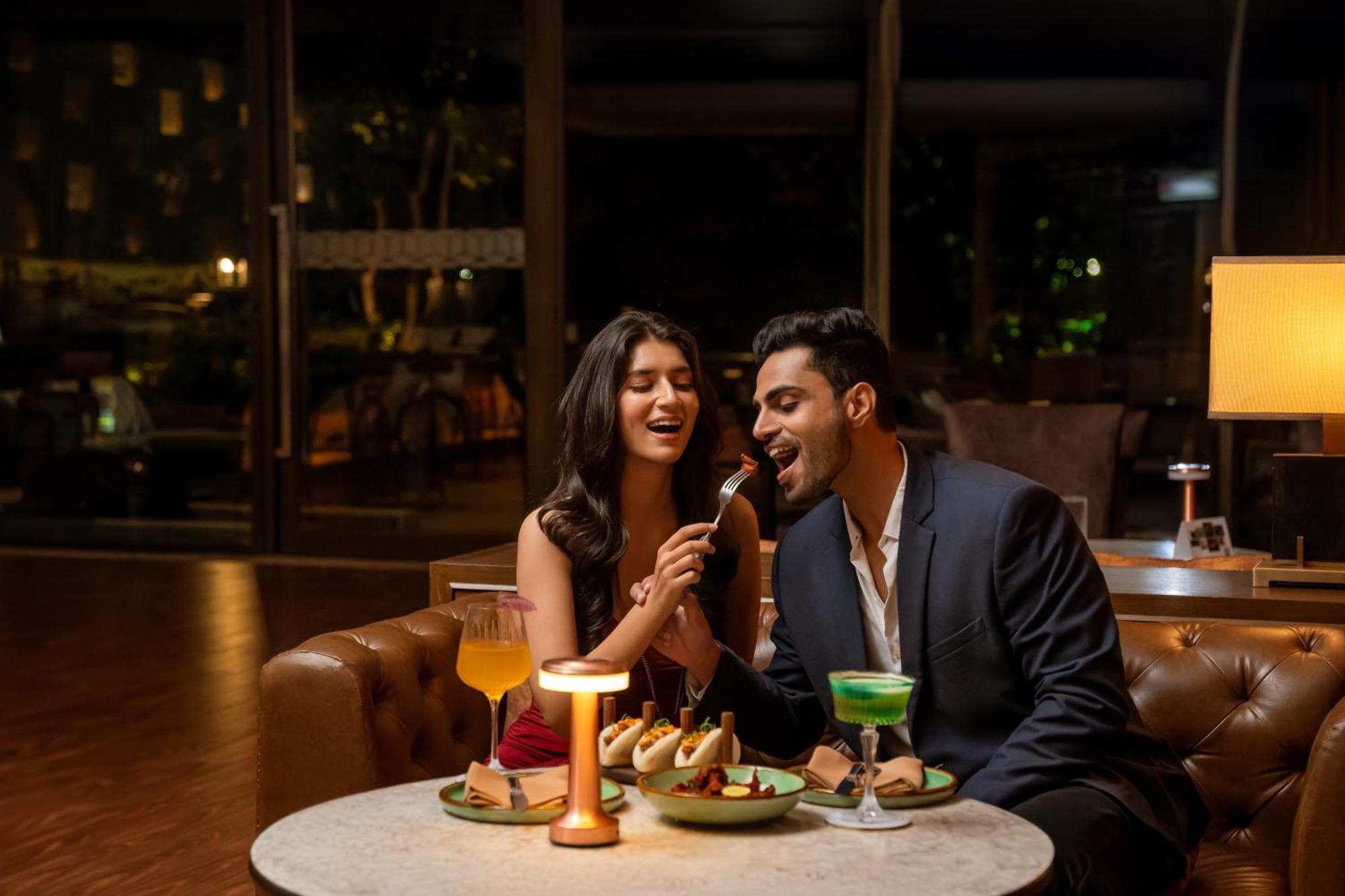 Hyatt Pune Esterno foto A couple dining at a restaurant