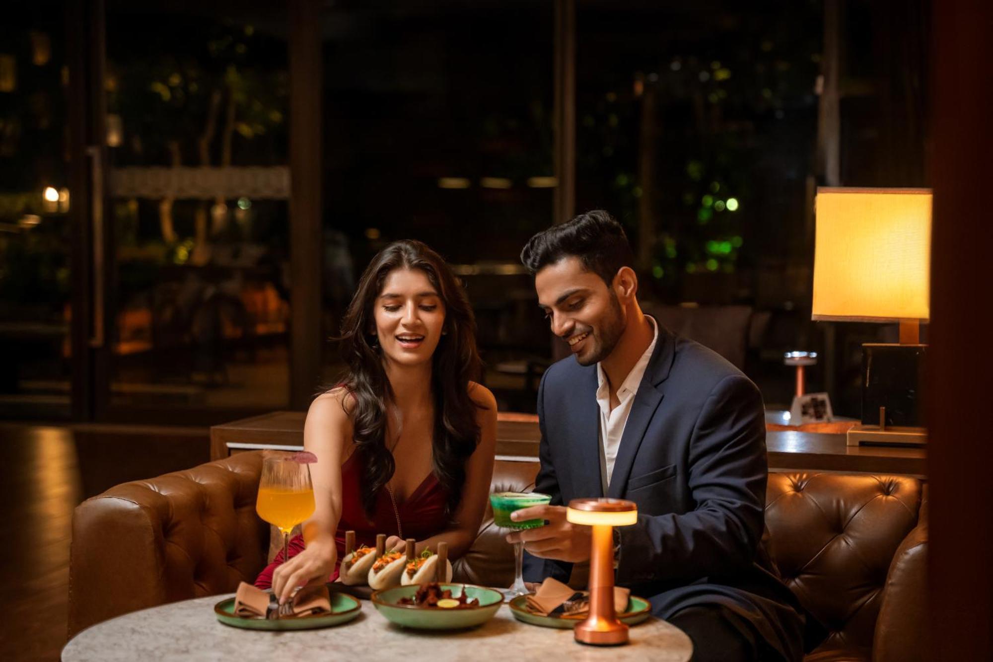 Hyatt Pune Esterno foto A couple dining at a restaurant