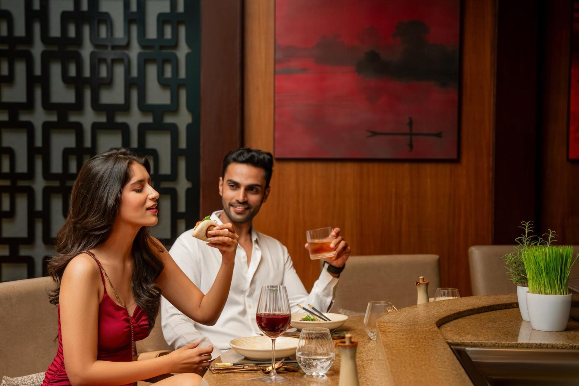 Hyatt Pune Esterno foto A couple dining at a restaurant